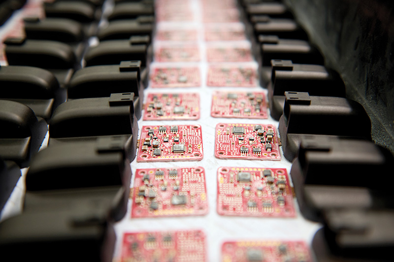 Electronic components moving through production